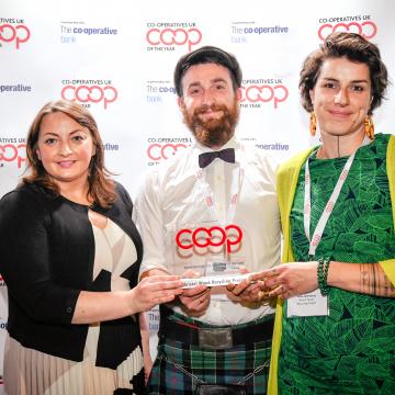 Two people being presented with an award