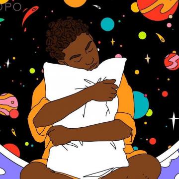 A person hugging a cushion